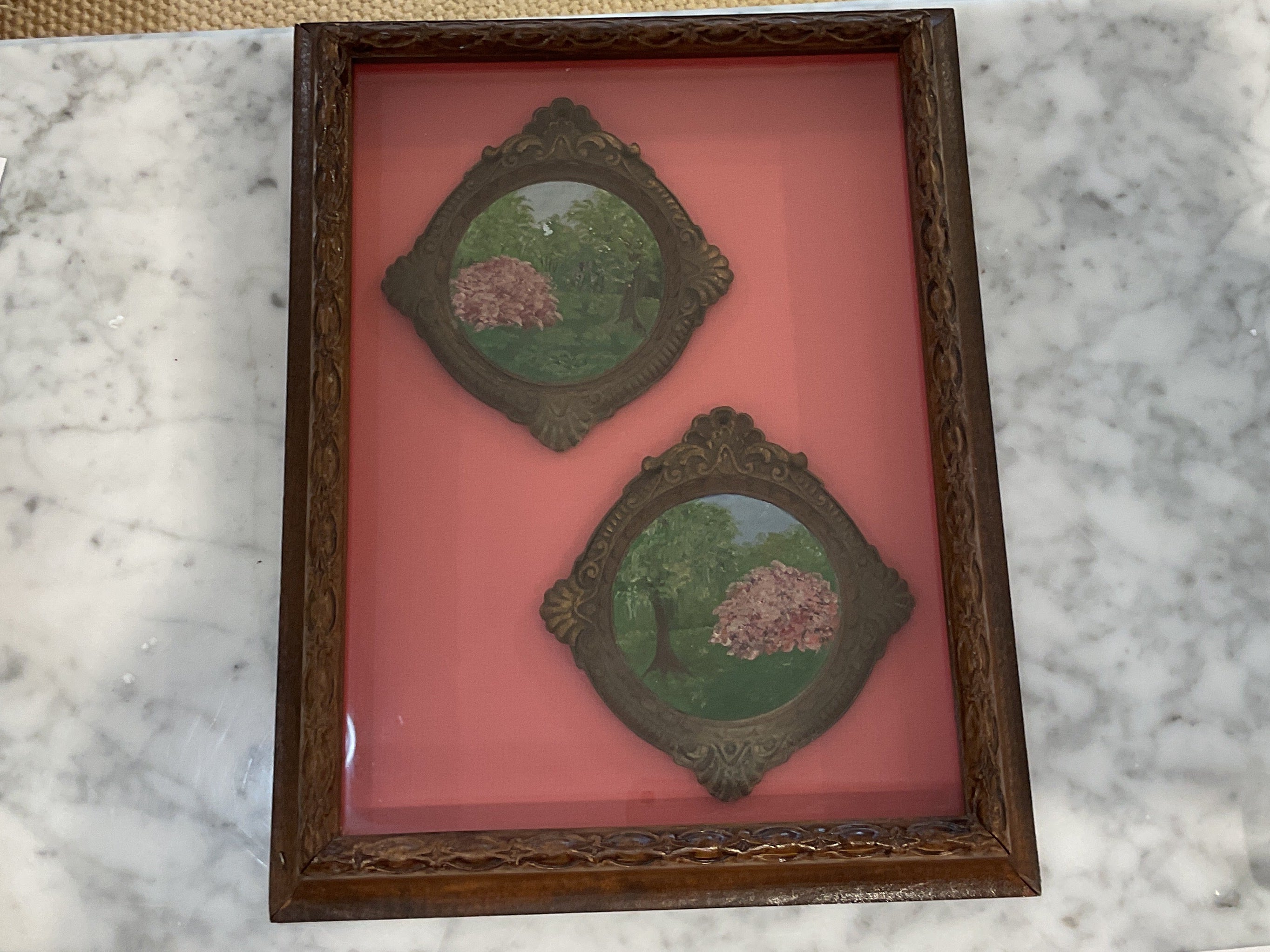 Antique paintings framed in a shadow box